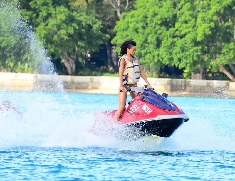 Illustration for article titled Rihanna Is Drinking Beers and Riding Jet Skis in Barbados Right Now